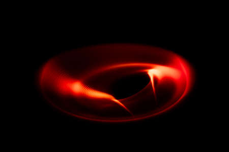 Sound waves in the visible red color in the darkの写真素材