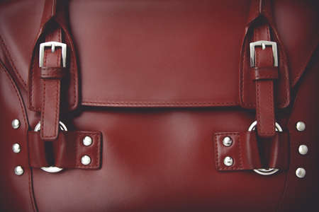 Red glossy female leather bag. With vintage toning effectの写真素材