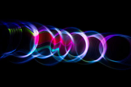 Sound waves in the visible blue color in the darkの写真素材