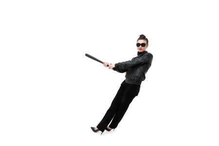 Portrait of an angry woman with a bat, isolated on white background. Serious and strict debt collectorの写真素材