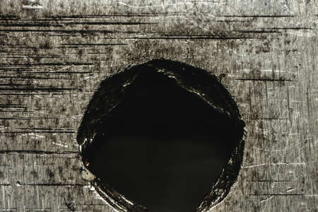 Close up of square in a metal with square holes insideの写真素材