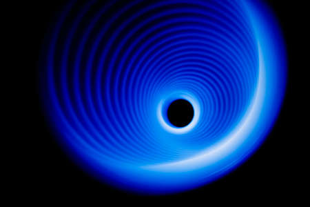 Blurred sound waves in the visible blue color in the darkの写真素材