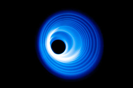 Blurred sound waves in the visible blue color in the darkの写真素材
