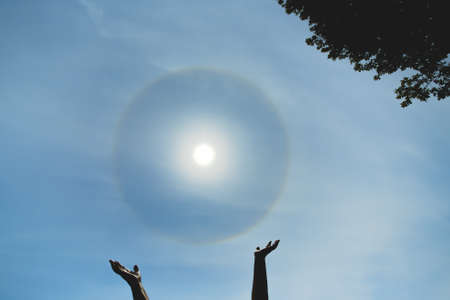 Reiki zen meditation. Atmospheric optical effect circle around the sun on hot summer dayの写真素材