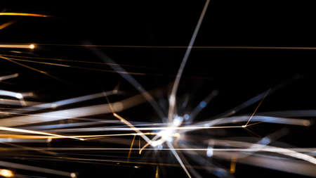 Wallpaper silicon sparks close up shot on dark backgroundの写真素材