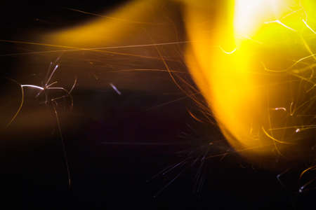 Wallpaper silicon sparks close up shot on dark backgroundの写真素材