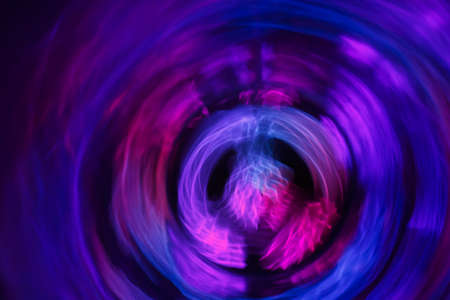 Yoga meditation woman in lotus pose with spiritual aura. Balancing your life concept. Abstract blurred backgroundの写真素材