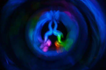 Yoga meditation woman in lotus pose with spiritual aura. Balancing your life concept. Abstract blurred backgroundの写真素材