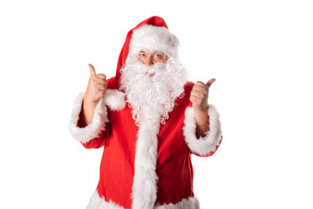 Funny fat man in Santa costume. Christmas and New Year. Holidays and giftsの写真素材