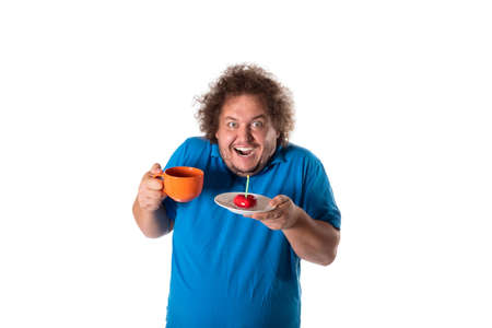 Funny fat man with mug and cake. Happy birthday. Joy and funの写真素材