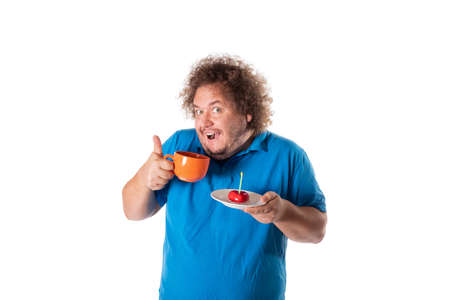 Funny fat man with mug and cake. Happy birthday. Joy and funの写真素材