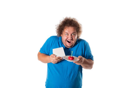 Funny fat man with cake and gift. Happy birthday. Joy and funの写真素材