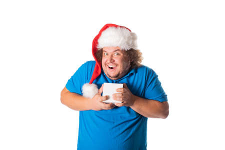 Funny fat man in Santa hat with gifts. Christmas and presents. Emotionsの写真素材