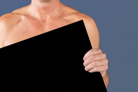 Man holding black blank billboardの写真素材