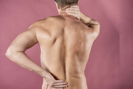 Man holding his painful inflamed loin. Health care and medicine.