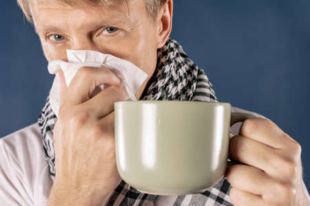 Adult man patient with cold and flu illness reliefの写真素材