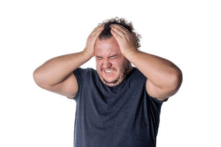 A fat man has high blood pressure and headache. Overweight and health problems
