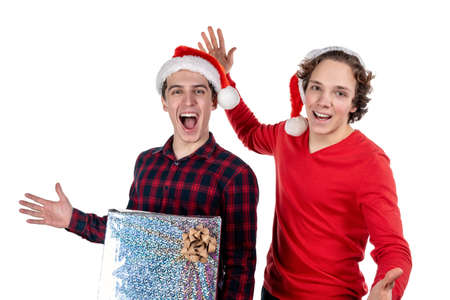 Two funny young men celebrating christmas isolated