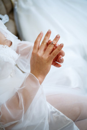 gold wedding rings in the hands of the newlywedsの写真素材