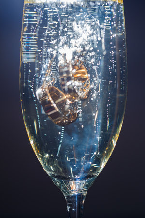 Gold wedding rings with water splashes