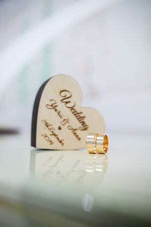 Gold wedding rings for newlyweds on wedding dayの写真素材
