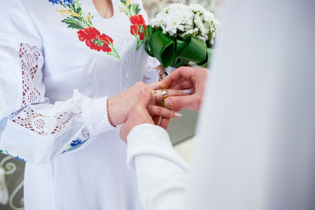 Golden wedding rings for newlyweds on their wedding dayの写真素材