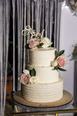 Beautiful tiered delicious dessert sweet cake for newlyweds.の写真素材