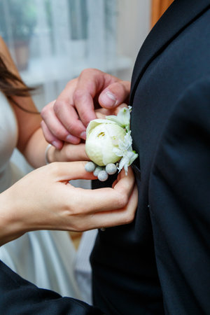 Beautiful wedding bouquet of flowers in the hands of the newlywedsの写真素材
