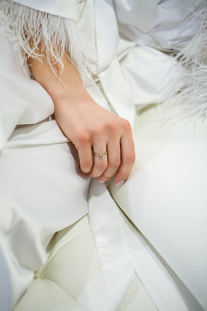 Beautiful young girl bride on a wedding day. White wedding dress. Modern dressy clothes for womenの写真素材