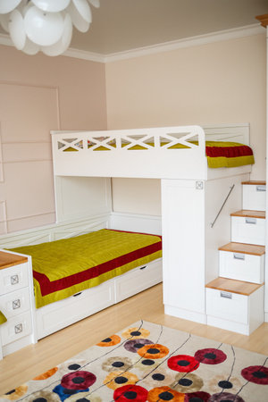 interior in a children's room with white furniture. Modern repair solutionの写真素材