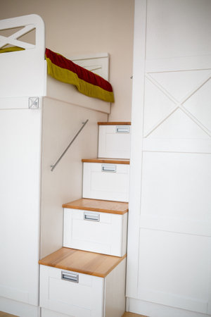 interior in a children's room with white furniture. Modern repair solutionの写真素材