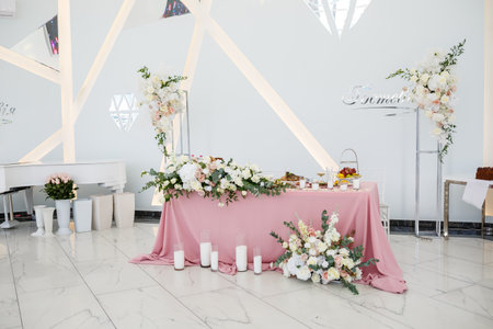 Wedding table decor for newlyweds decorations with fresh flowersの写真素材