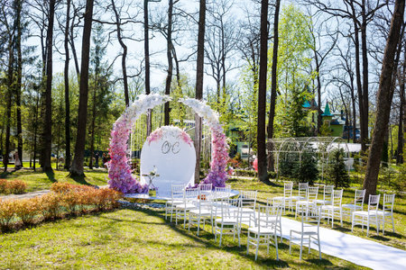 Festive arch for the ceremony of painting the newlyweds on the wedding day, wedding decor with fresh flowersの写真素材