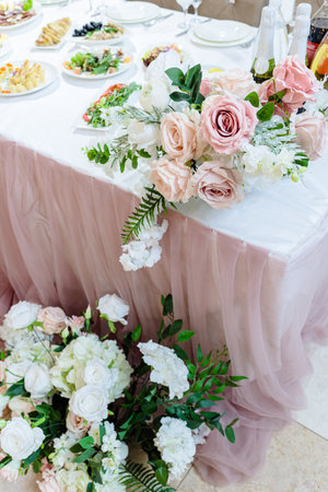 Wedding table decor for newlyweds decorations with fresh flowersの写真素材