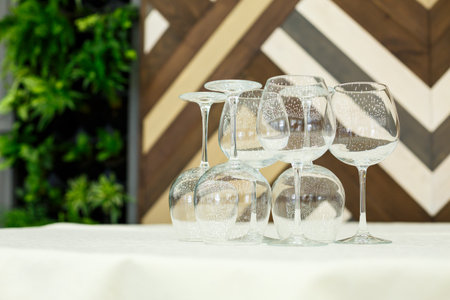 Glass glasses with drinks stand on a tableの写真素材