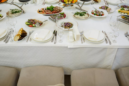 Serving a festive table in a restaurant. Preparation of a banquet for a holiday. Expensive...