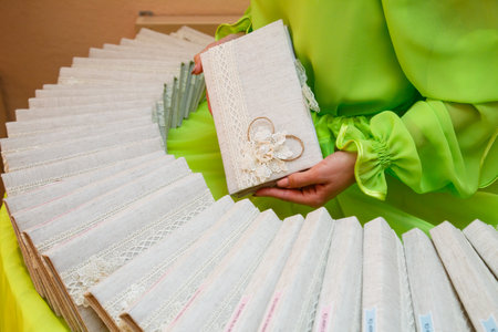 Woman holds handmade tissue cards in her handsの写真素材
