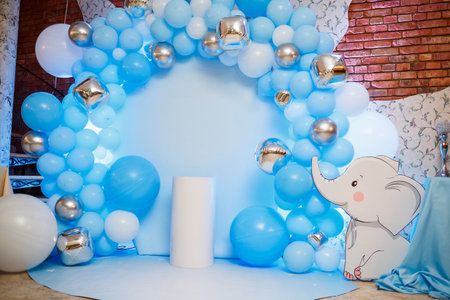 Photo zone with balloons. Boy's birthday decor. Festive decoration. Balloons. Childrens party background. Festive photo zone in blue.の写真素材