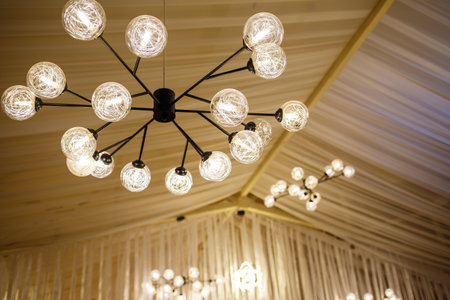Modern loft chandelier with many shades with energy saving lampsの写真素材