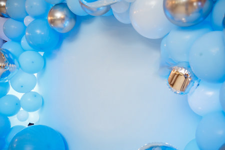 Photo zone with balloons. Boy's birthday decor. Festive decoration. Balloons. Childrens party background. Festive photo zone in blue.の写真素材