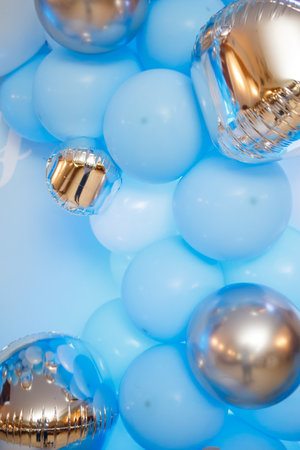 Photo zone with balloons. Boy's birthday decor. Festive decoration. Balloons. Childrens party background. Festive photo zone in blue.の写真素材