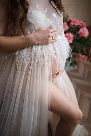 Photo pregnant girl, pregnancy, close-up, pink dressの写真素材