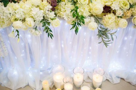Wedding decor made of flowers and fabric. Beautiful decorations for newlyweds on their wedding dayの写真素材