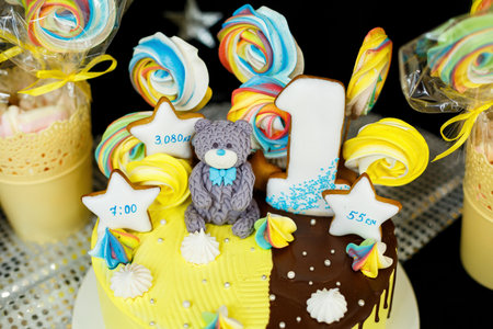 Sweet beautiful cake and other sweets for a child's birthdayの写真素材