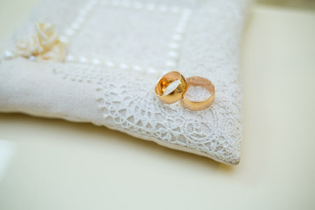 Gold wedding rings for newlyweds on their wedding day. Jewelry for the holiday of a couple in loveの写真素材