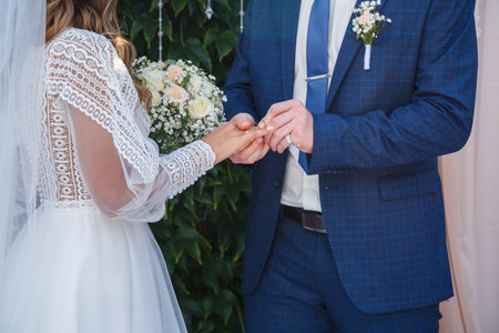 Newlyweds on wedding day, wedding couple holding hands, bride and groom