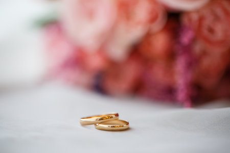 Golden wedding rings for newlyweds on their wedding dayの写真素材