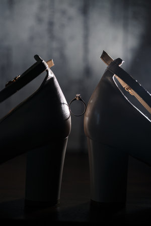 Bride's engagement ring on wedding day with beautiful holiday shoesの写真素材