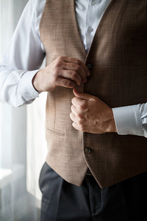 Young male businessman is dressing a stylish suit for an important meeting. Clothing for an adult man. Selective focusの写真素材