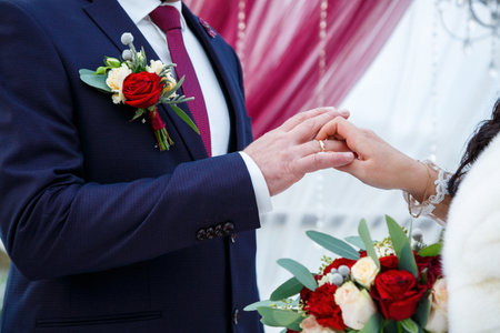 Golden wedding rings for newlyweds on their wedding dayの写真素材